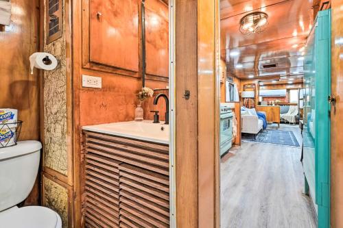 a bathroom with a sink and a toilet and a sink at Charming Tiny Home with Private Hot Tub! in Plant City