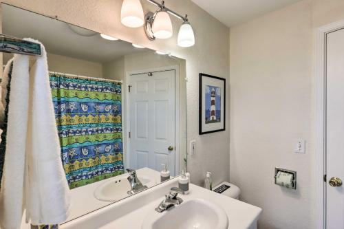 a bathroom with a sink and a mirror at Delafield Vacation Rental Near Lakes and Parks! in Delafield