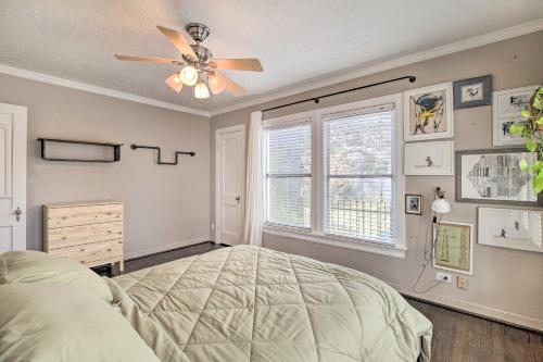 a bedroom with a bed and a ceiling fan at Charming Historic Houston Home with Yard! in Houston