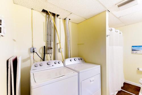 a laundry room with a washer and dryer at Chatham Living in Chatham