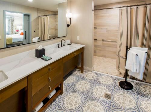 a bathroom with a large sink and a shower at Best Western Dry Creek Inn in Healdsburg