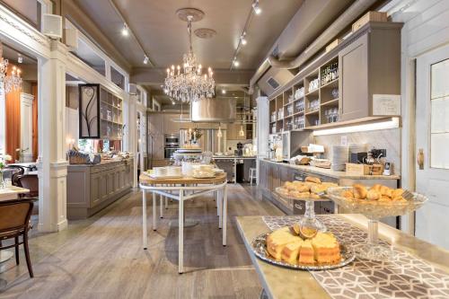 a large kitchen with a table with bread on it at Best Western Hotel Baltic in Sundsvall