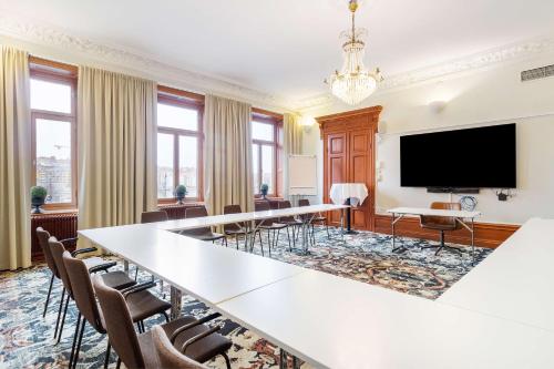 a meeting room with a large table and chairs at Best Western Hotel Baltic in Sundsvall