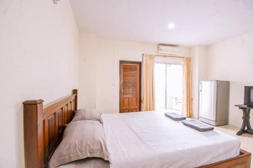 Postel nebo postele na pokoji v ubytování We Residence
