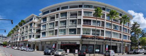 a tall building with cars parked in front of it at My Daily Homestay - Miri Times Square in Miri
