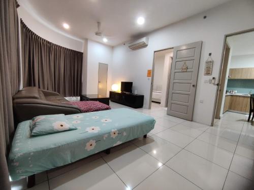 a bedroom with a bed and a living room at My Daily Homestay - Miri Times Square in Miri