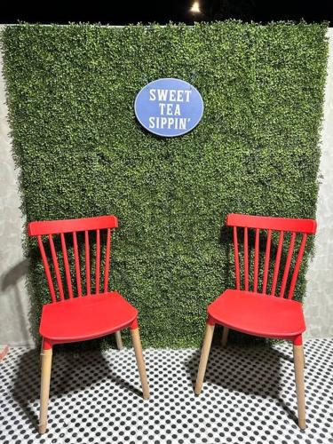 two red chairs sitting in front of a green wall at Seafront OnCall - private jacuzzi with 4 cozy bedrooms in San Juan