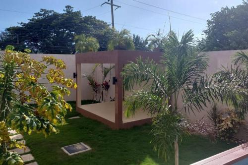 a garden with a fence and some plants at Odyssey Exquisite @ Charlemont in Kingston