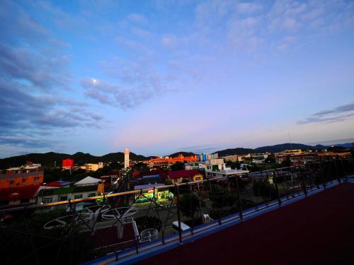 a view of a city with buildings in the background at Stardust Boutique Hotel in Hua Hin