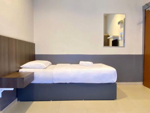 Ένα ή περισσότερα κρεβάτια σε δωμάτιο στο Chemor Inn