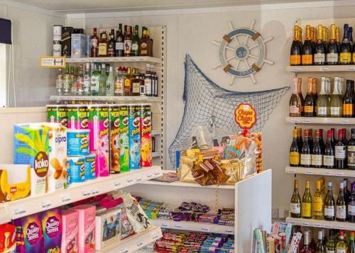 a store filled with lots of food and drinks at Otters Mead Boutique Lodges in Beetley