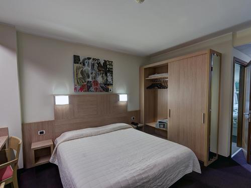 Postel nebo postele na pokoji v ubytování Hotel Capital