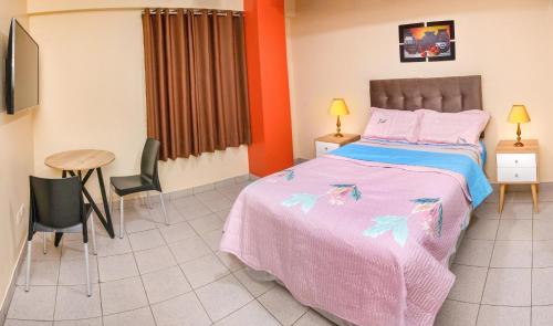 Кровать или кровати в номере Hotel Royal