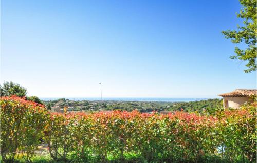 a view from the garden of a house with flowers at Awesome Home In La Gaude With Kitchen in La Gaude