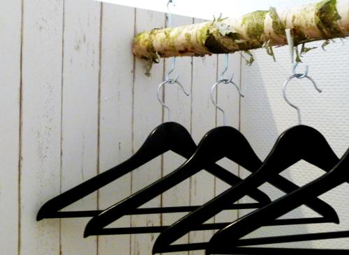 a group of hangers hanging on a wall at Hotel Liegeplatz 13 Kiel by Premiere Classe in Kiel