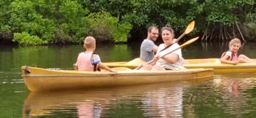 a group of people in a boat on the water at Gems Garden Guest House in Tangalle