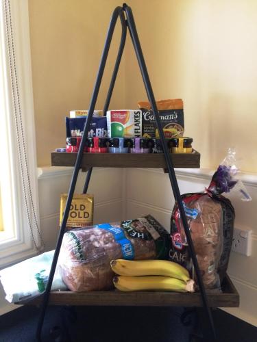 a shelf with a bunch of food on it at The Retreat at Amryhouse in Ashbourne