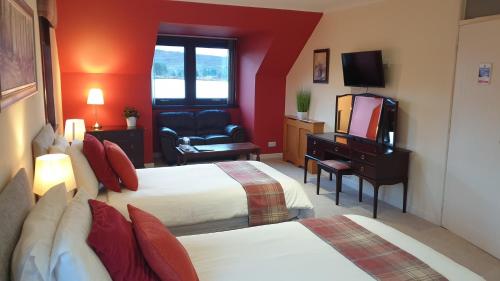 Säng eller sängar i ett rum på Loch View, Lairg