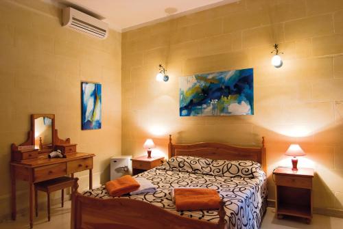 Postel nebo postele na pokoji v ubytování Djar Ta Menzja 3 Holiday Home
