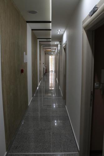 a corridor of a building with a long hallway at Bed & Breakfast Park Gate in Vranje