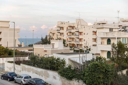 a group of cars parked in front of buildings at Casa Mar y Sol in Torre a Mare
