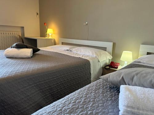 Ένα ή περισσότερα κρεβάτια σε δωμάτιο στο Hotel Miura
