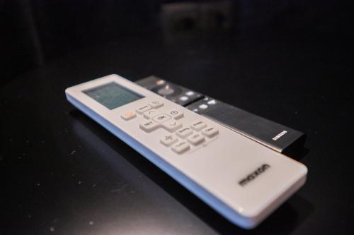a remote control sitting on top of a table at DMS Apartments & Suites Sarajevo in Vogošća