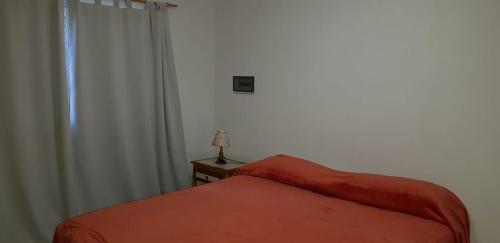 מיטה או מיטות בחדר ב-DORMIS La Faustina
