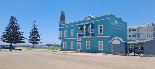 a blue building on the side of a road at Jetty Self-Catering in Swakopmund