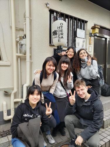 a group of people posing for a picture at OTERA HOUSE 瑞　TAMA in Osaka