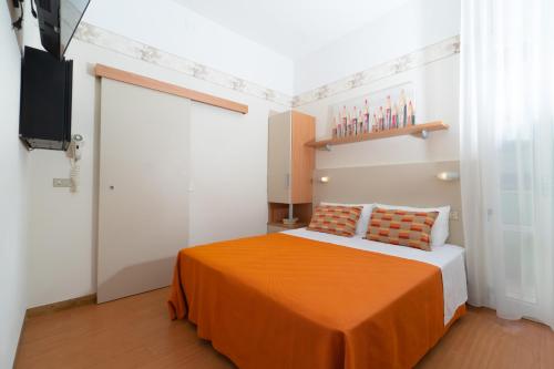 Postel nebo postele na pokoji v ubytování Hotel Sampaoli