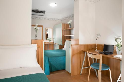 Postel nebo postele na pokoji v ubytování Hotel Sampaoli