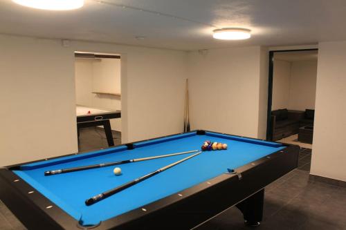 a pool table with balls on it in a room at Äppelgården in Sollebrunn