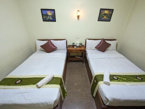 Postel nebo postele na pokoji v ubytování Reach Kunthea Guesthouse