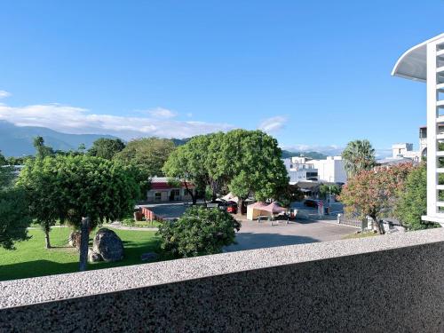 a view of a park from the balcony of a building at Happy Fat B&B 寵物友善 in Taitung City