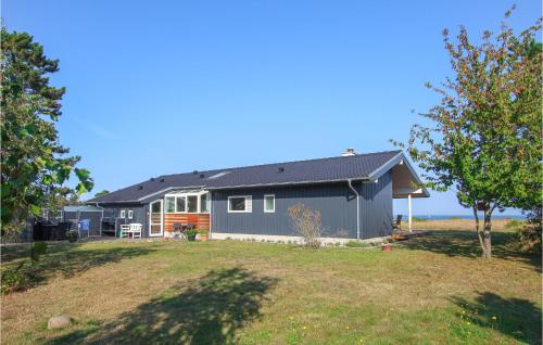 a house with a large yard in front of it at Gorgeous Home In Samsø With Kitchen in Nordby