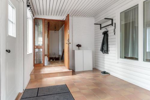 a hallway of a home with white walls at Peaceful holiday home surrounded by nature in Töllsjö