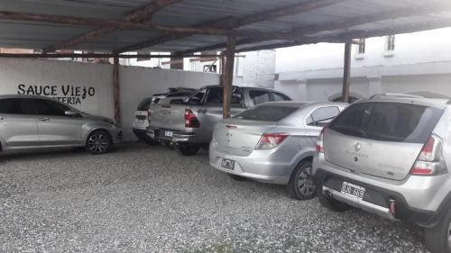 a group of cars parked in a parking lot at Sauce Viejo in Mina Clavero