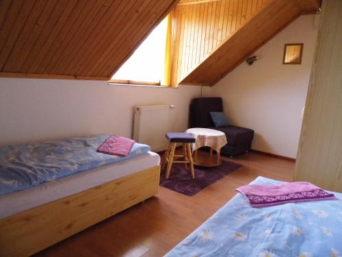 A bed or beds in a room at Vila pri Váhu