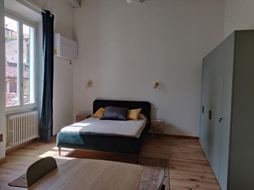 Ένα ή περισσότερα κρεβάτια σε δωμάτιο στο Borgo Central Apartment