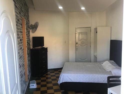 Postel nebo postele na pokoji v ubytování APARTA-ESTUDIO EN LA ZONA COLONIAL
