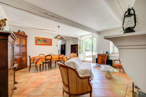 a living room with a couch and a table at Mas du PERUSSIER in Cucuron