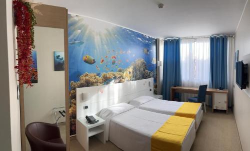 Cama o camas de una habitación en Hotel Sporting Brugherio