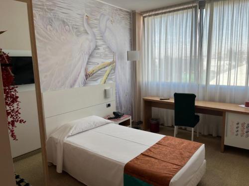 Cama o camas de una habitación en Hotel Sporting Brugherio