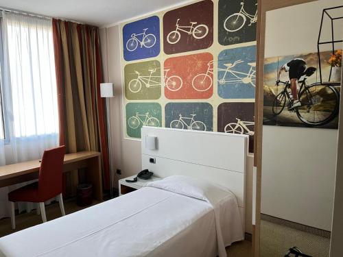 Cama o camas de una habitación en Hotel Sporting Brugherio