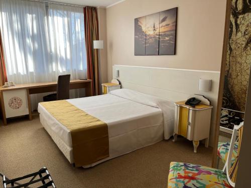 Cama o camas de una habitación en Hotel Sporting Brugherio