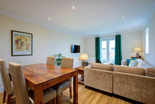 a living room with a table and a couch at Inglewood Apartment, Ingleton, Yorkshire Dales National Park, Famous 3 Peaks and Near The Lake District Pet Friendly in Ingleton