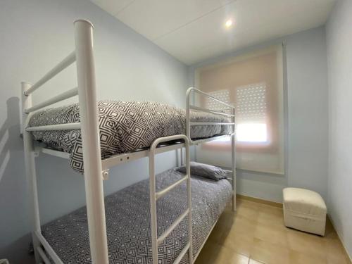 A bed or beds in a room at Ca la Mercè