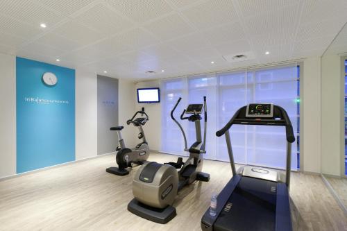 a gym with two exercise bikes in a room at Novotel Suites Paris Montreuil Vincennes in Paris