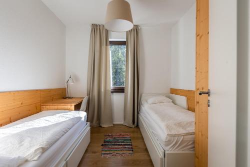 Postel nebo postele na pokoji v ubytování Lúčnica apartments Tále